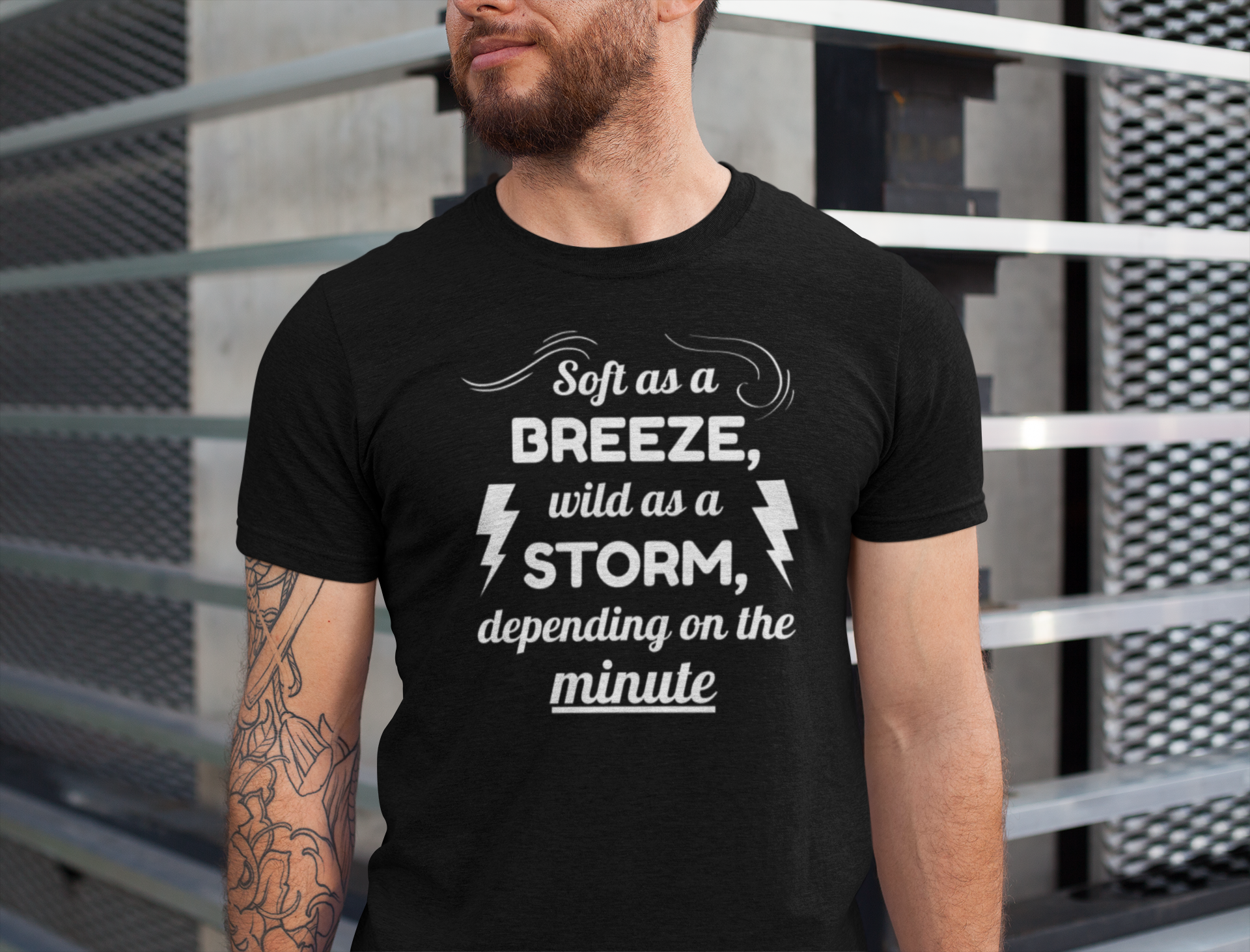 Man wearing a black t-shirt with a humorous quote design.