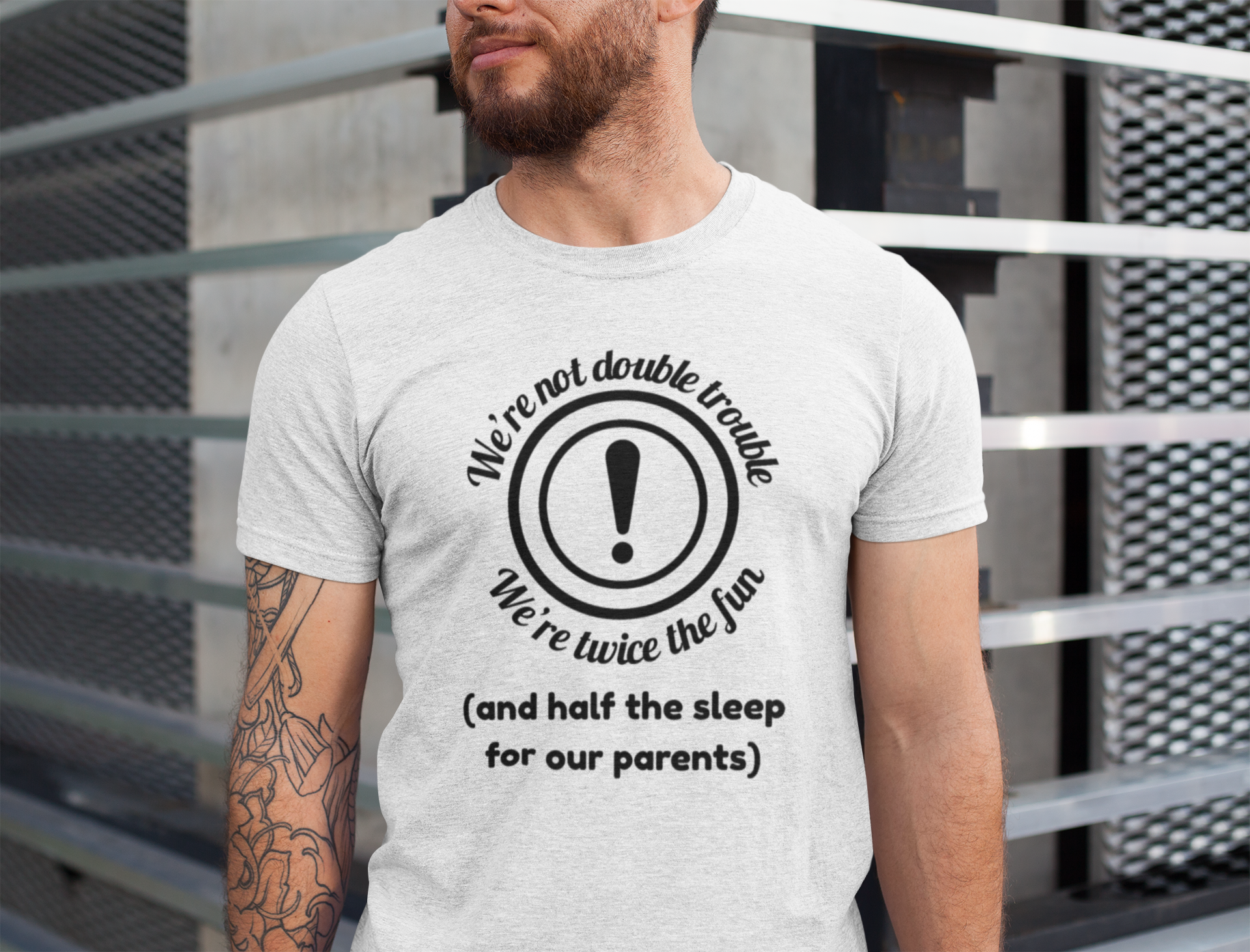 Man wearing a gray twin energy t-shirt for twins  with a humorous design and text.
