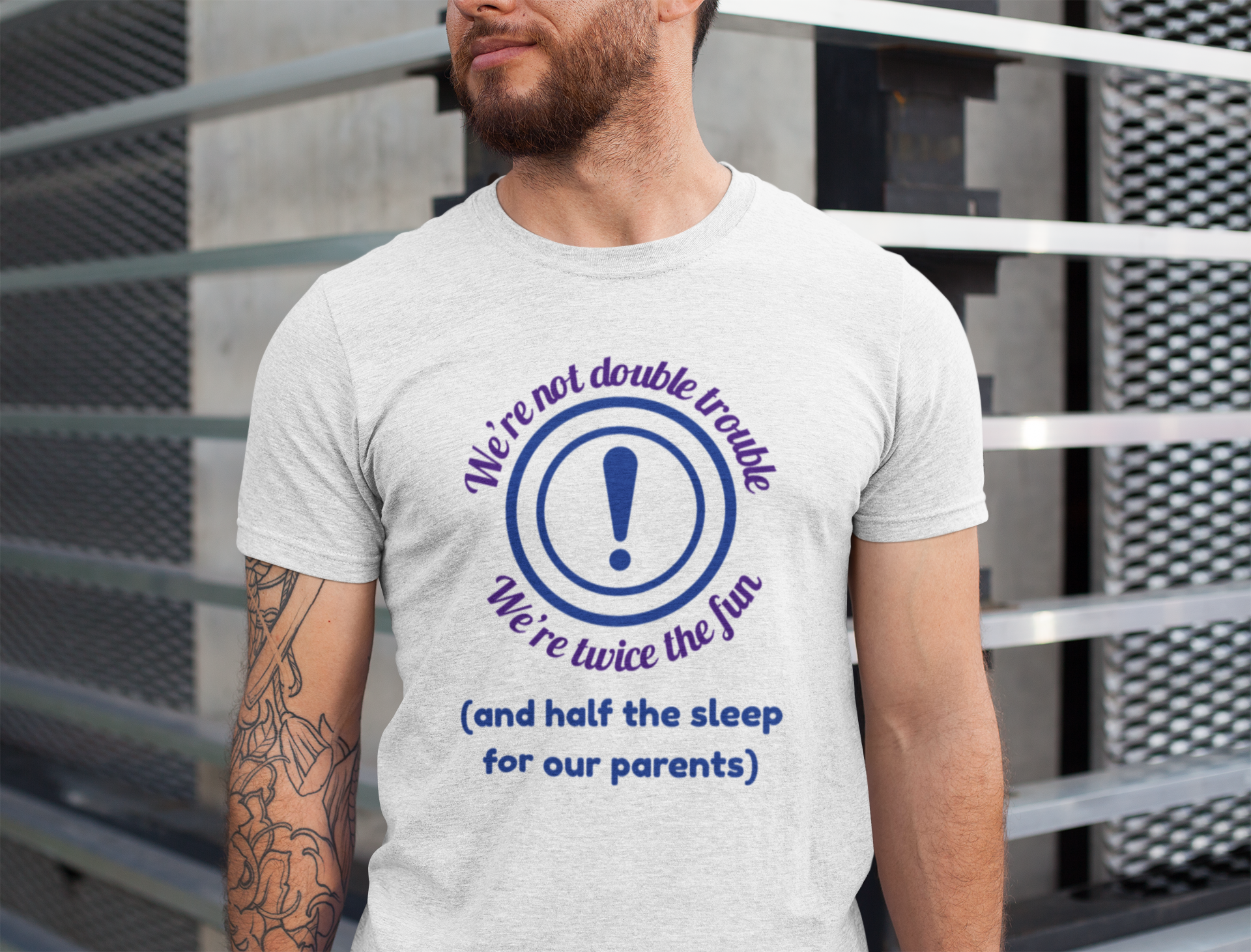 Man wearing a white twin energy t-shirt for with a humorous design and text.