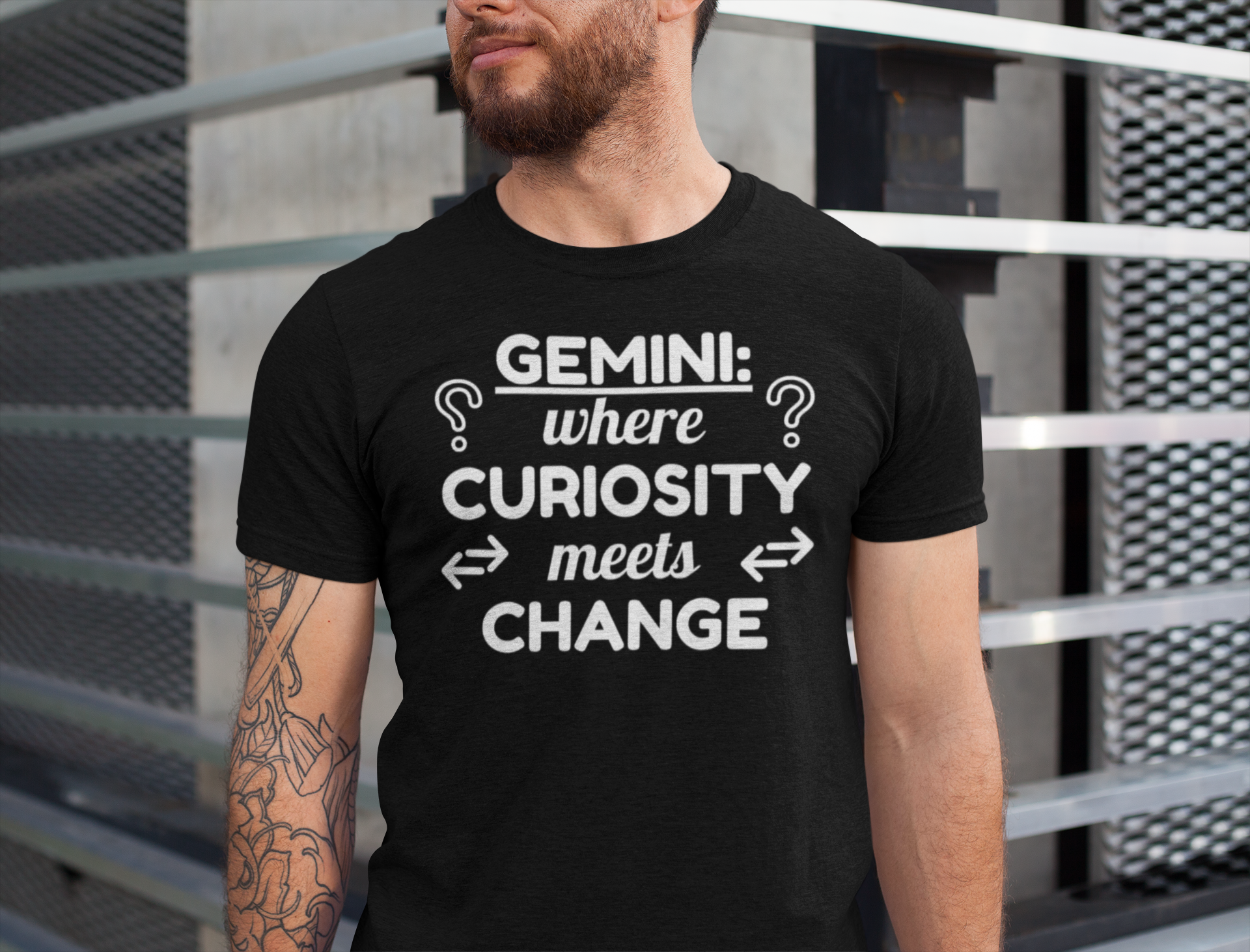 Person wearing a black t-shirt with Gemini zodiac design text.