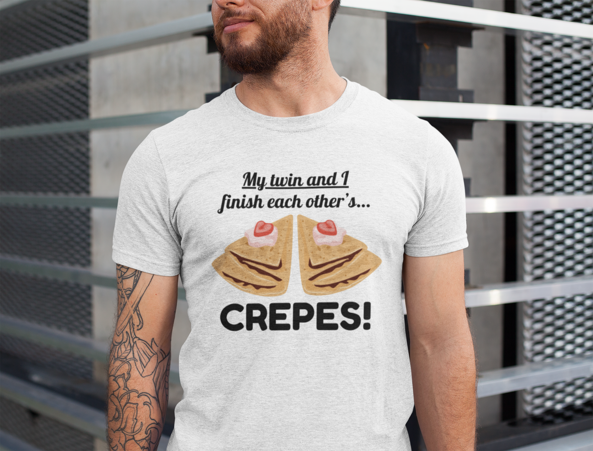 Man wearing a t-shirt for twins with a graphic of two crepes and text about them finishing each other.