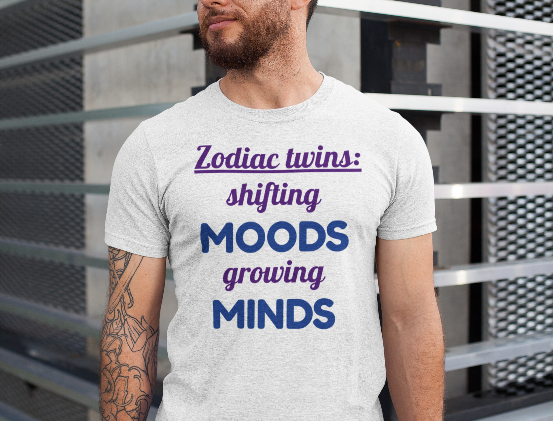 Person wearing a t-shirt with Gemini zodiac twins text design.