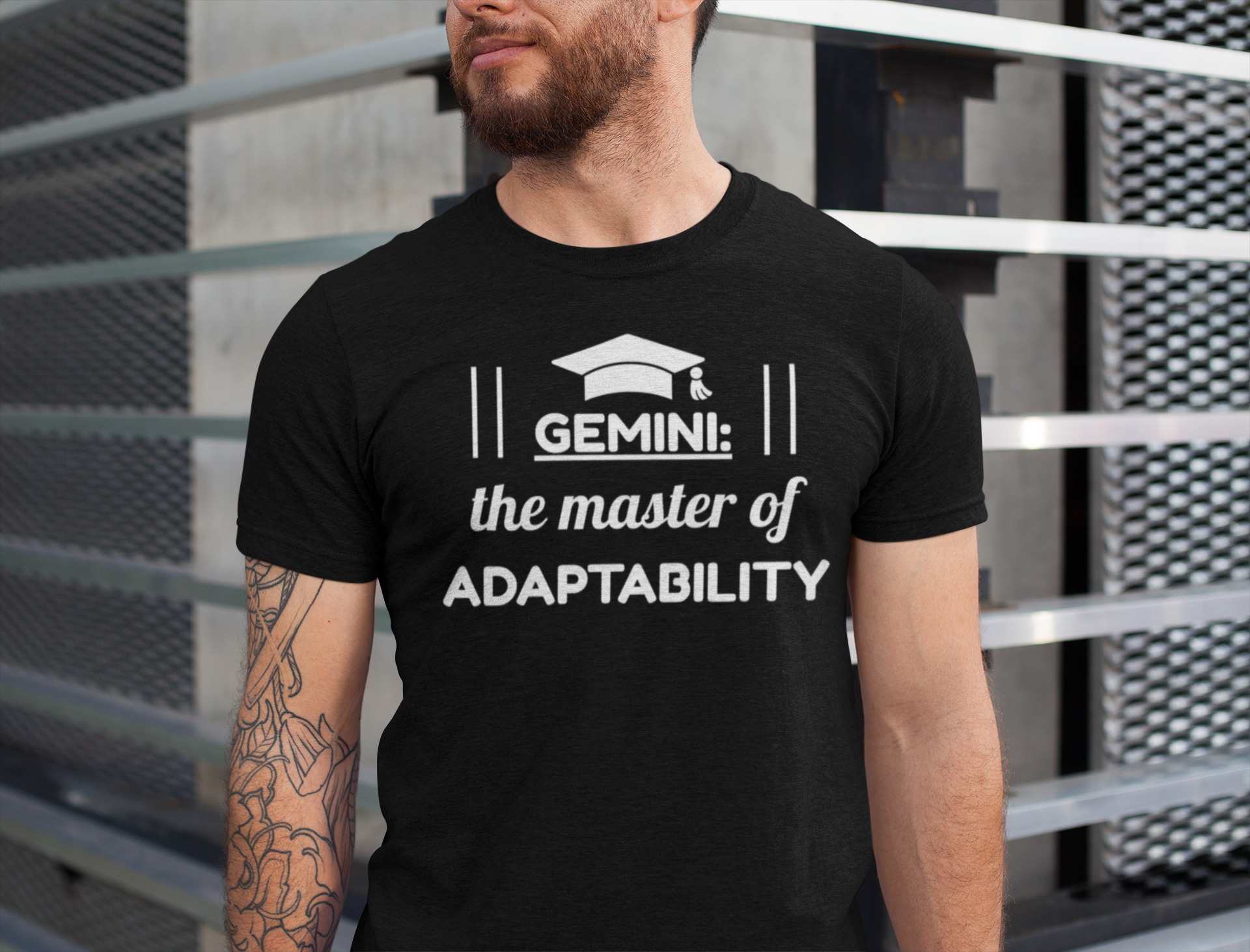 Person wearing a black t-shirt with 'Gemini: the master of adaptability' text and graphic.