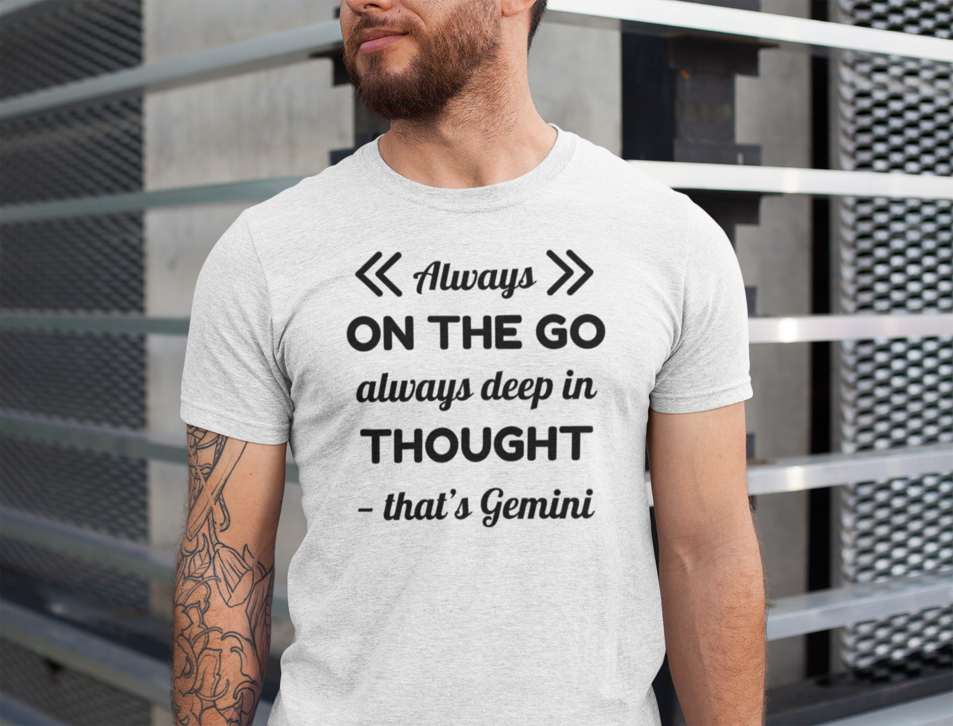 Man wearing a t-shirt with a Gemini zodiac quote design.