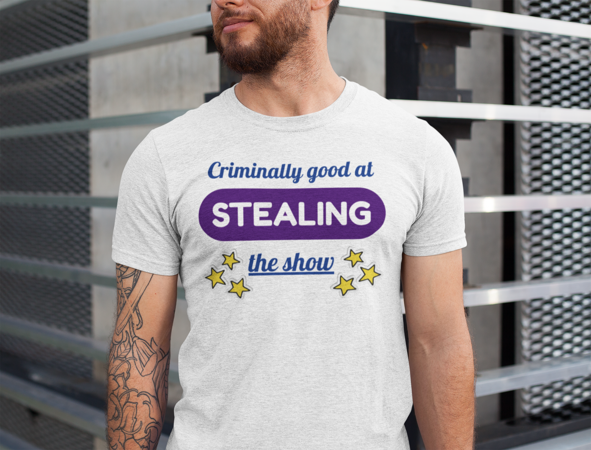Man wearing a t-shirt for twins with text and stars design against a metallic background