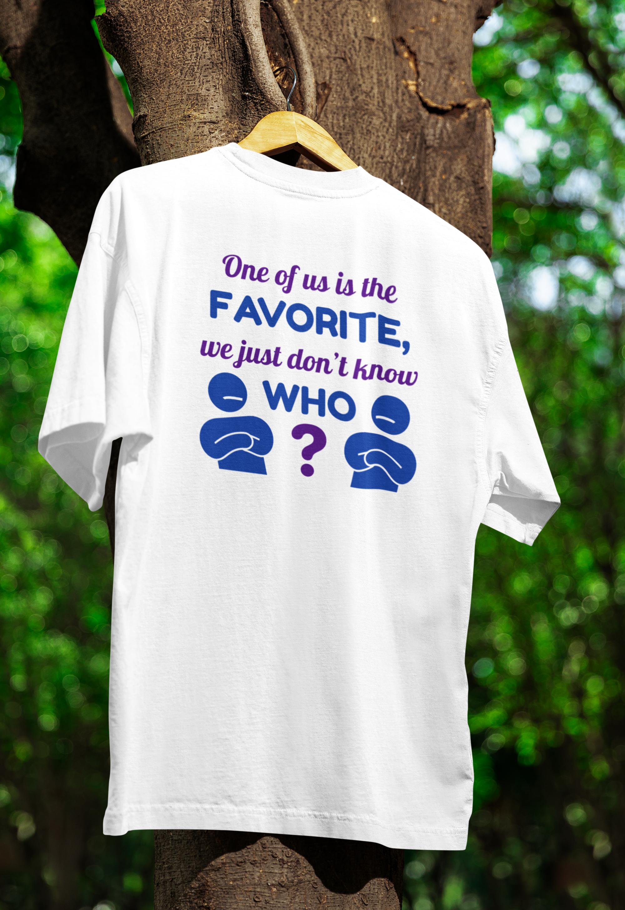 White t-shirt for twins with text and question marks on a wooden hanger against a tree background