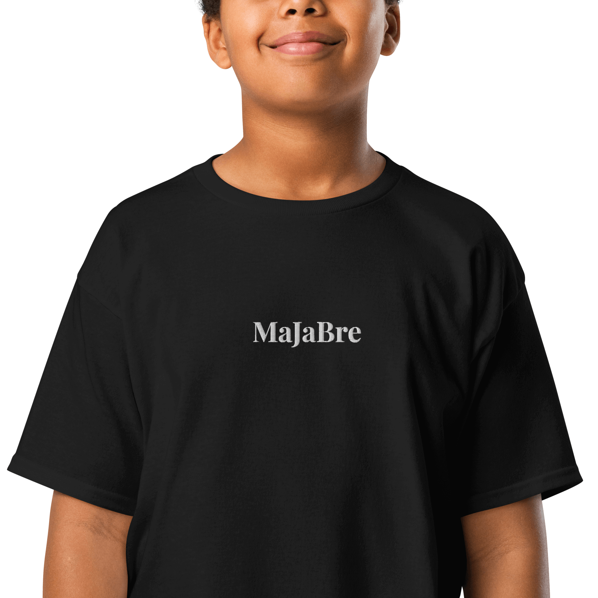 A boy wearing black twin shirt for kids with white majabre sign