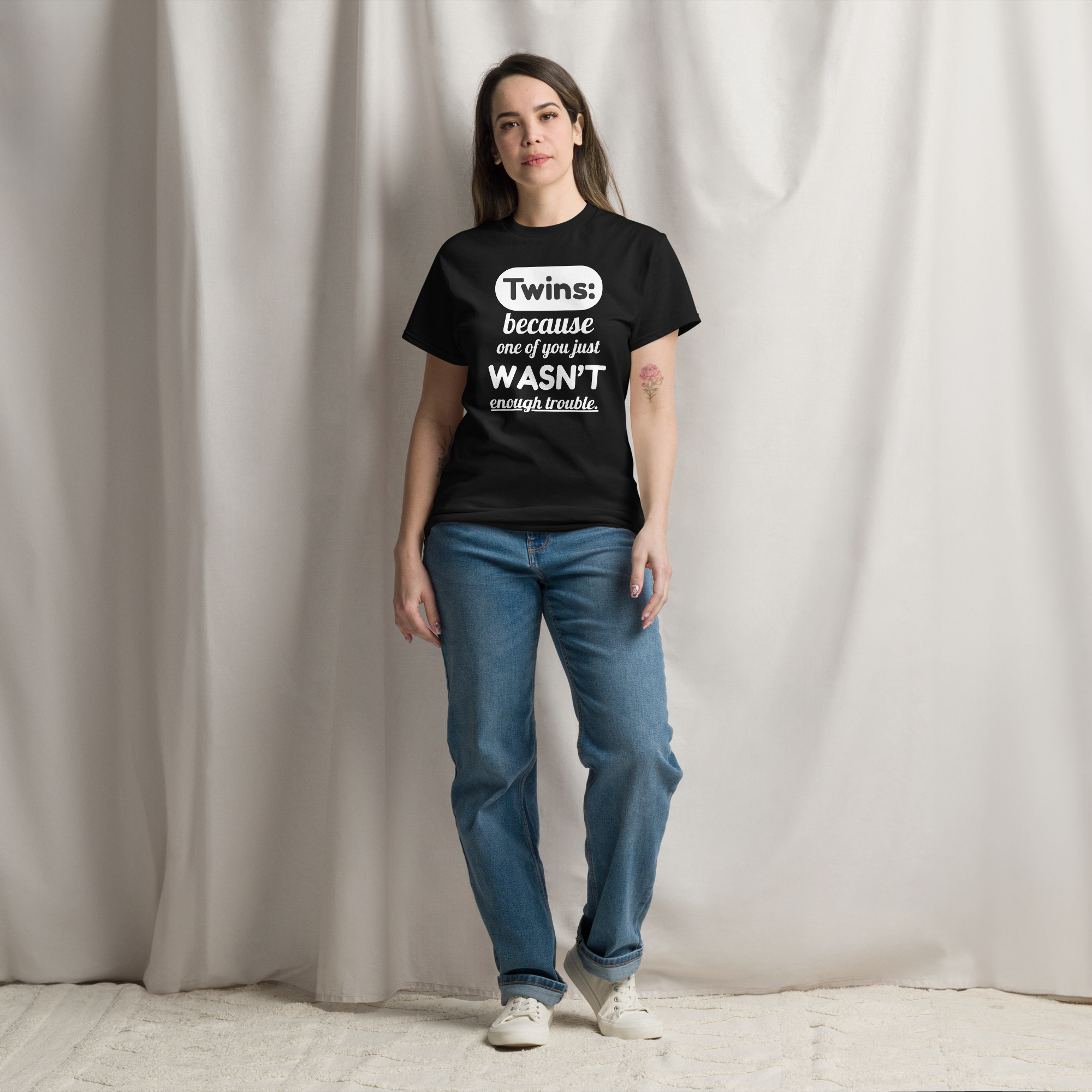 a woman wearing black twin shirt for adultst