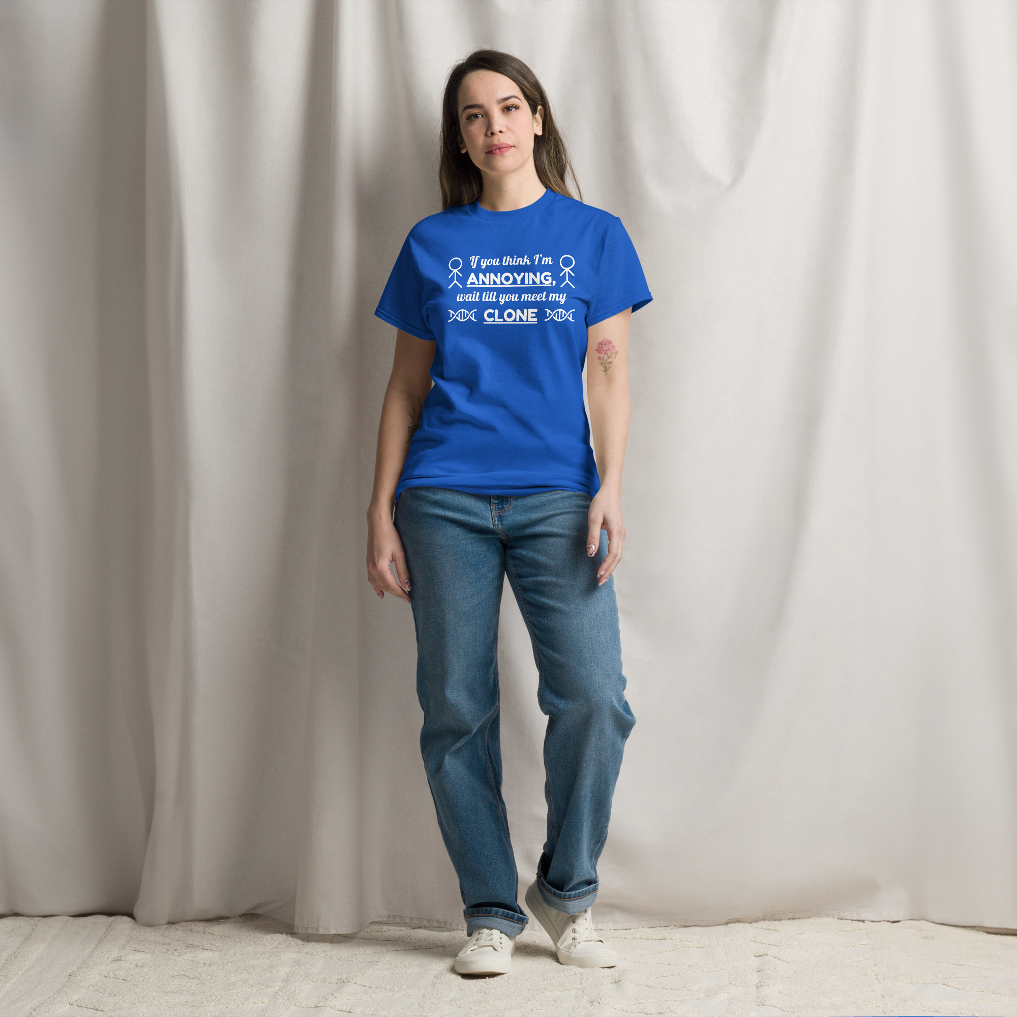 A woman wearing blue twin energy t-shirt with white letters on it