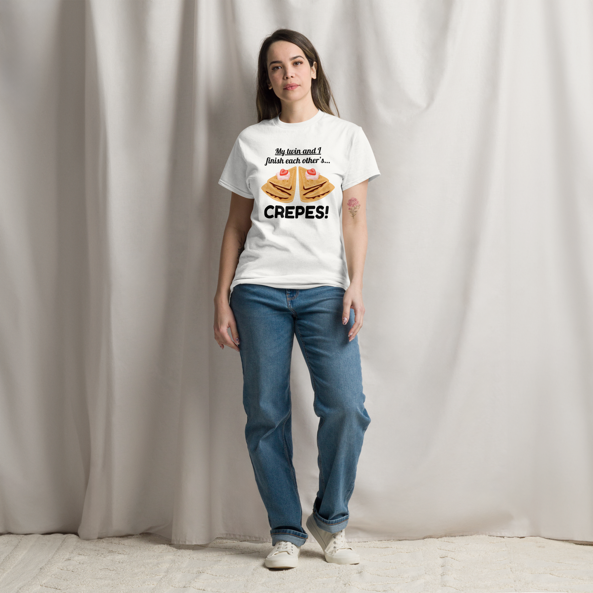 A young woman wearing twin vibes t-shirt 